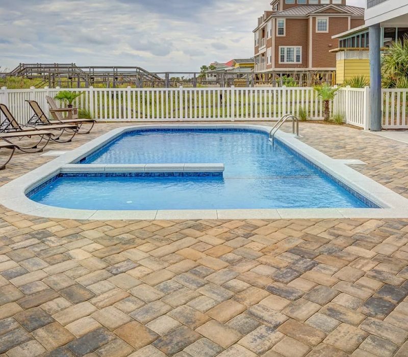 inground pool with chairs